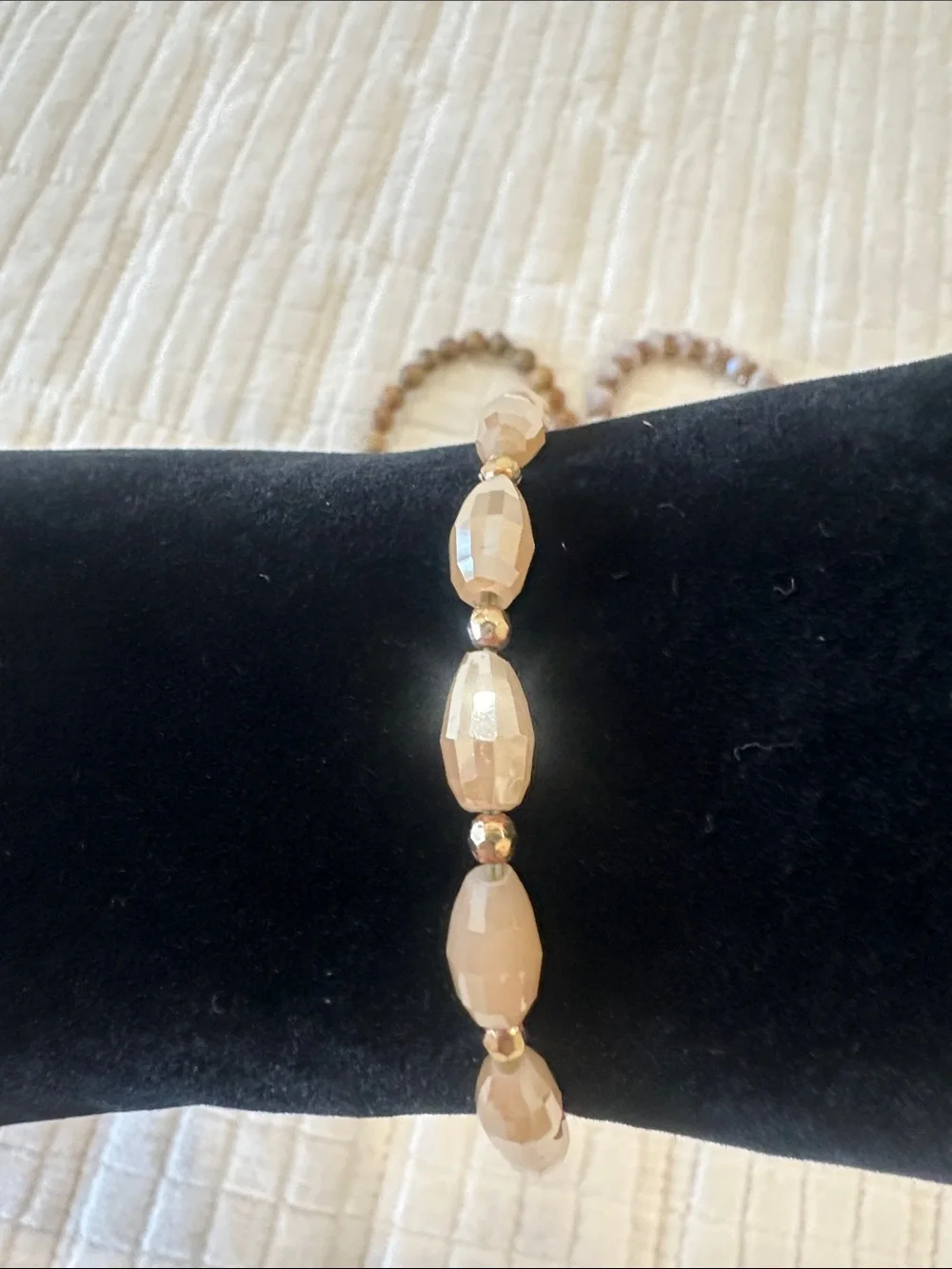 Neutral Stone and Faceted Bead Stack Bracelet with Gold Feather Charm